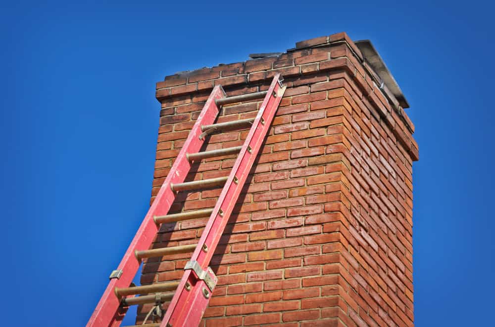Red Ladder Against Old Chimney Chimney Repair Nassau County, NY